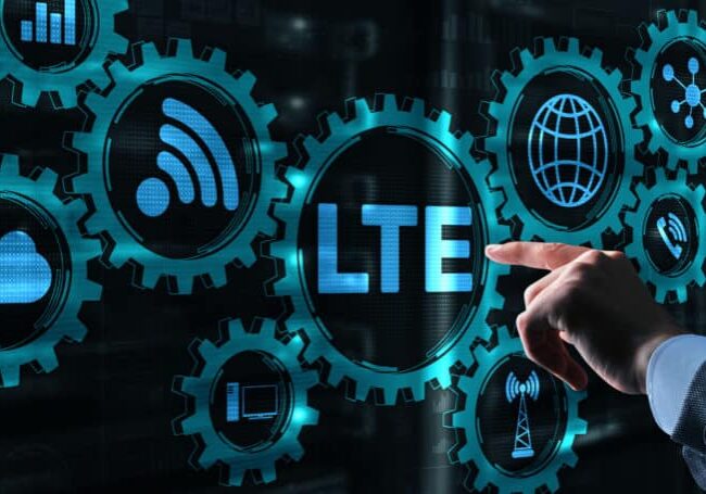 Technology internet business. Young business man presses with a finger LTE