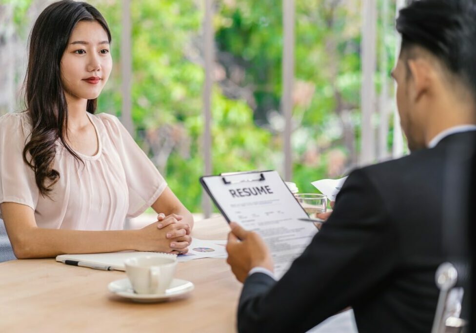 Young Asian woman graduate interviewing with two manager with positive motion in meeting room,Business Hiring new member, Job interview with manager concept